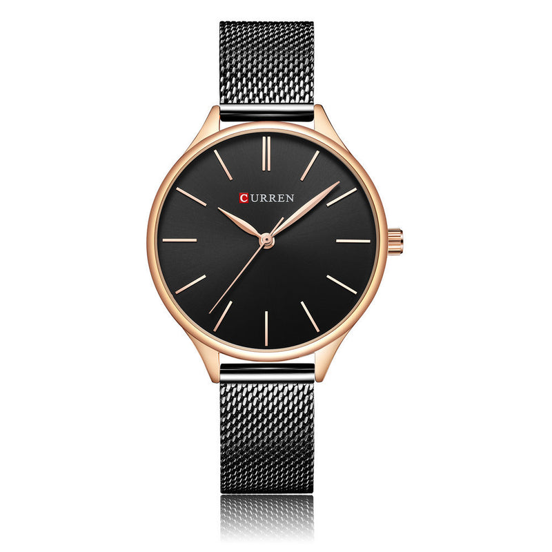 Wristwatch with a black face in rose gold casing with a mesh silver band on a white background